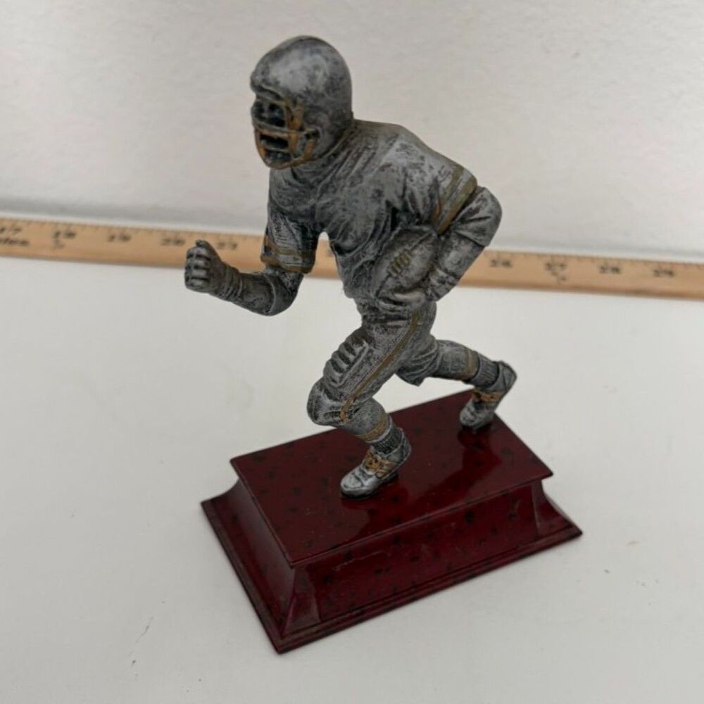 vtg football resin trophy on wooden base